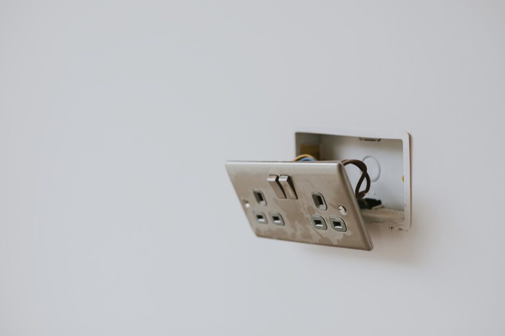 Broken power outlet on the wall