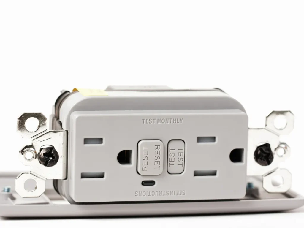 electrician testing a GFCI outlet