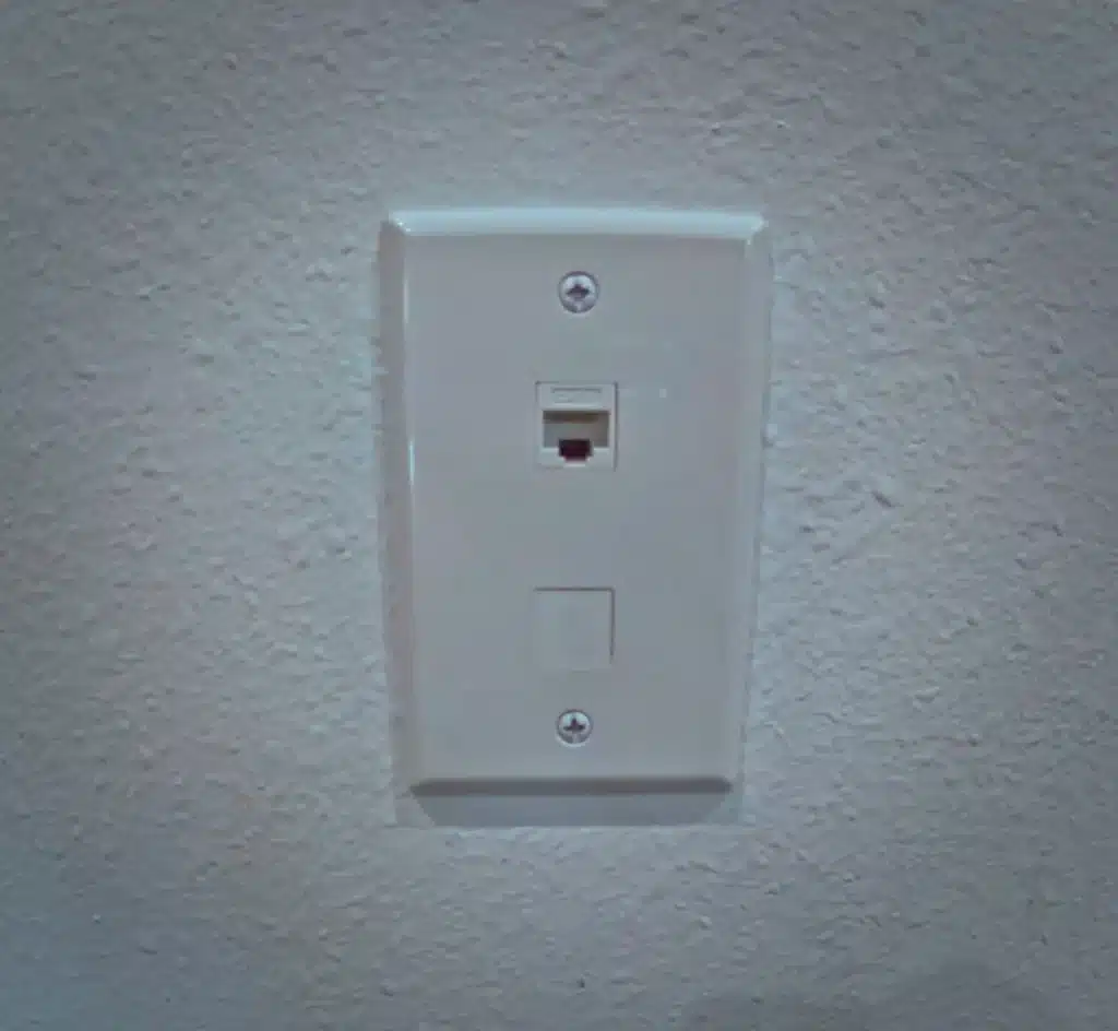 Electrician working on network wiring