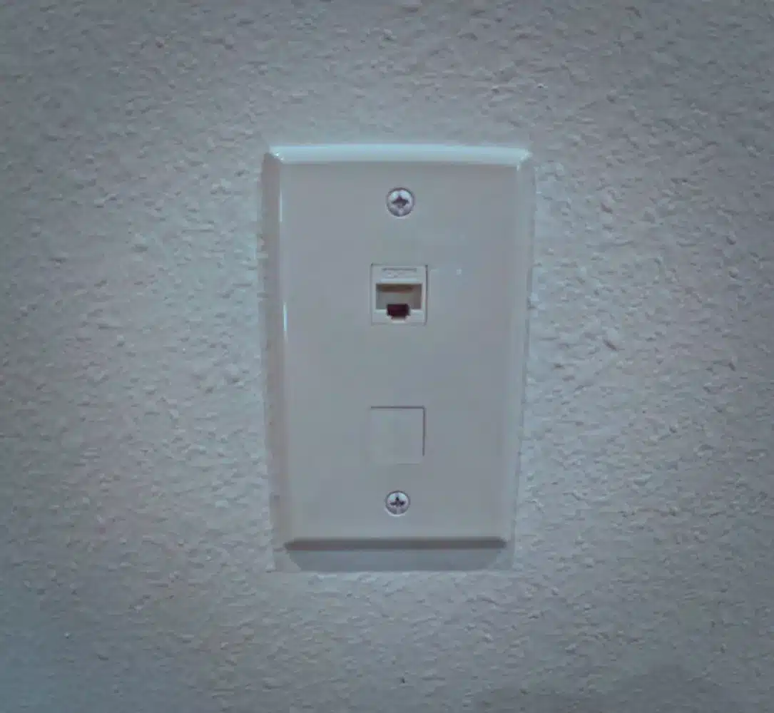 Electrician working on network wiring