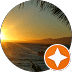 Sunset over a calm ocean with palm trees in the foreground, symbolizing relaxation and tranquility, relevant to Rewired Iowa's commitment to providing safe and reliable electrical services.